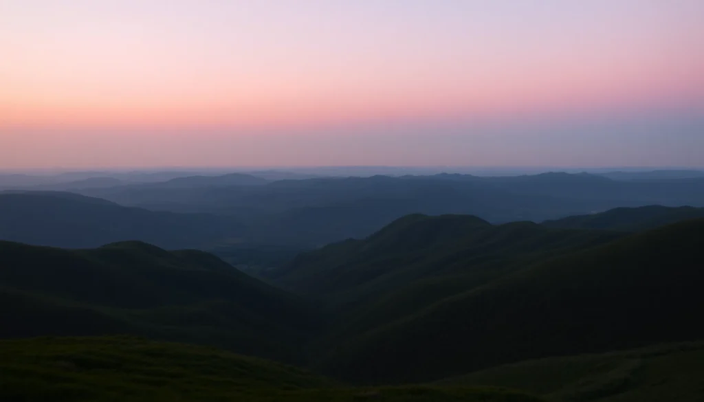 Scenic view showcasing long hills enveloped in twilight with lush valleys beneath.
